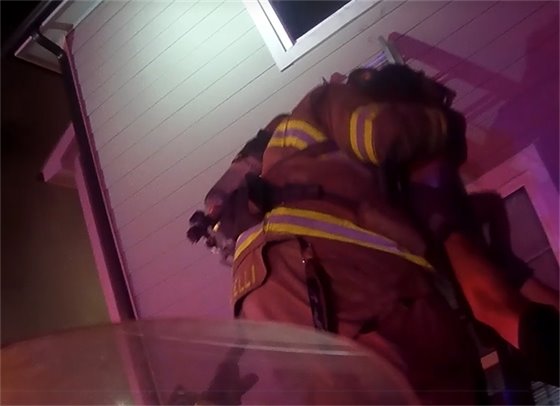 Screen shot of firefighter on ladder